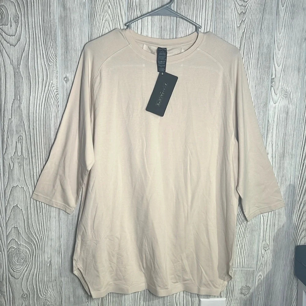 Woman’s alphalete cream T-shirt, three-quarter sleeve size medium